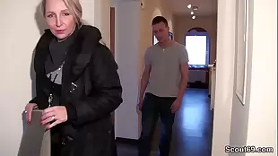 Milf realtor catches a jerk off guard at home and fucks him
